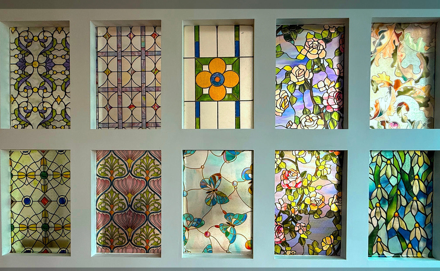 A display frame showing six stained glass window film patterns side by side