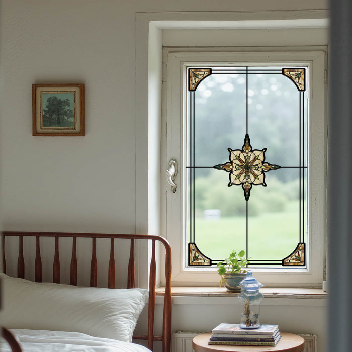 Art Deco stained glass window film with an amber and brown star medallion and corner fans on a bedroom window
