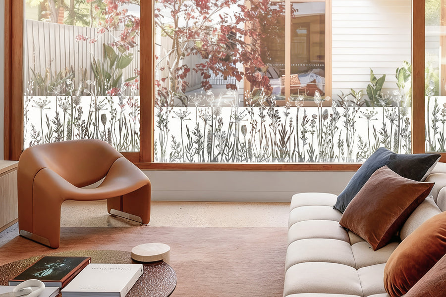 Floral stained glass window film across the lower panes of a kitchen window