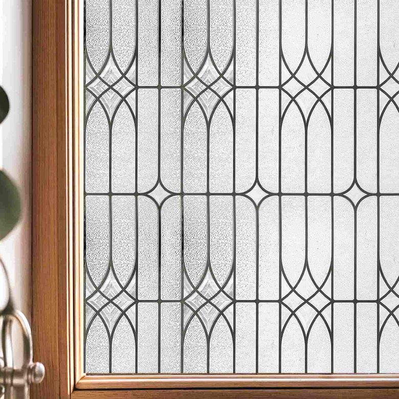 Leaded glass window film on a sash window, its clear geometric lattice seen against daylight