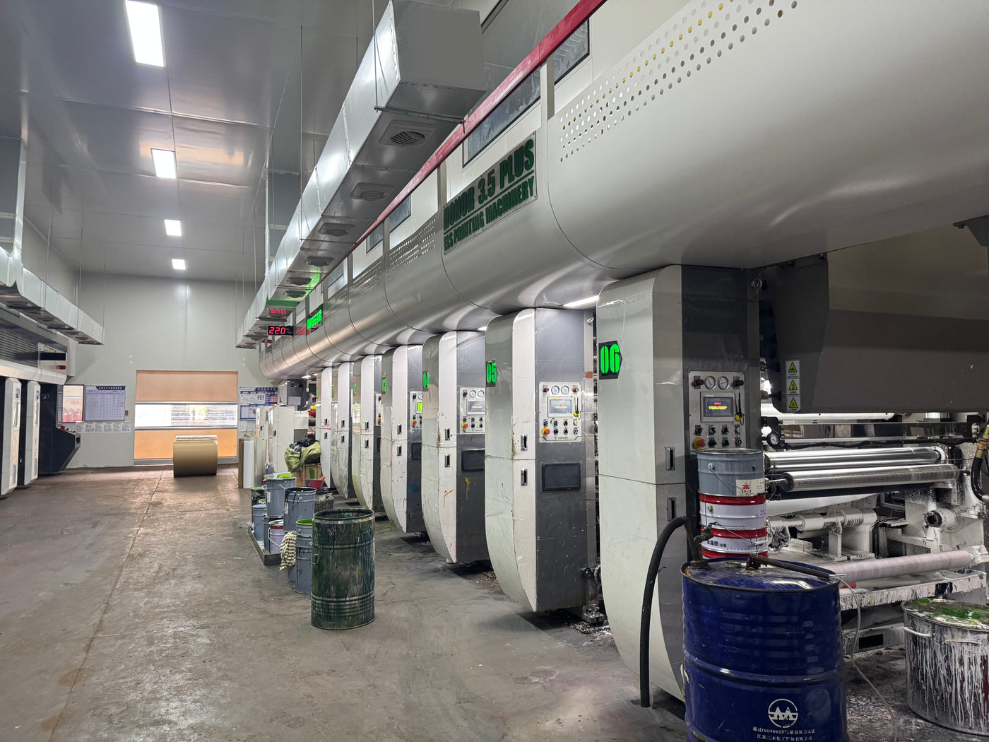 A long printing line running the length of the factory hall